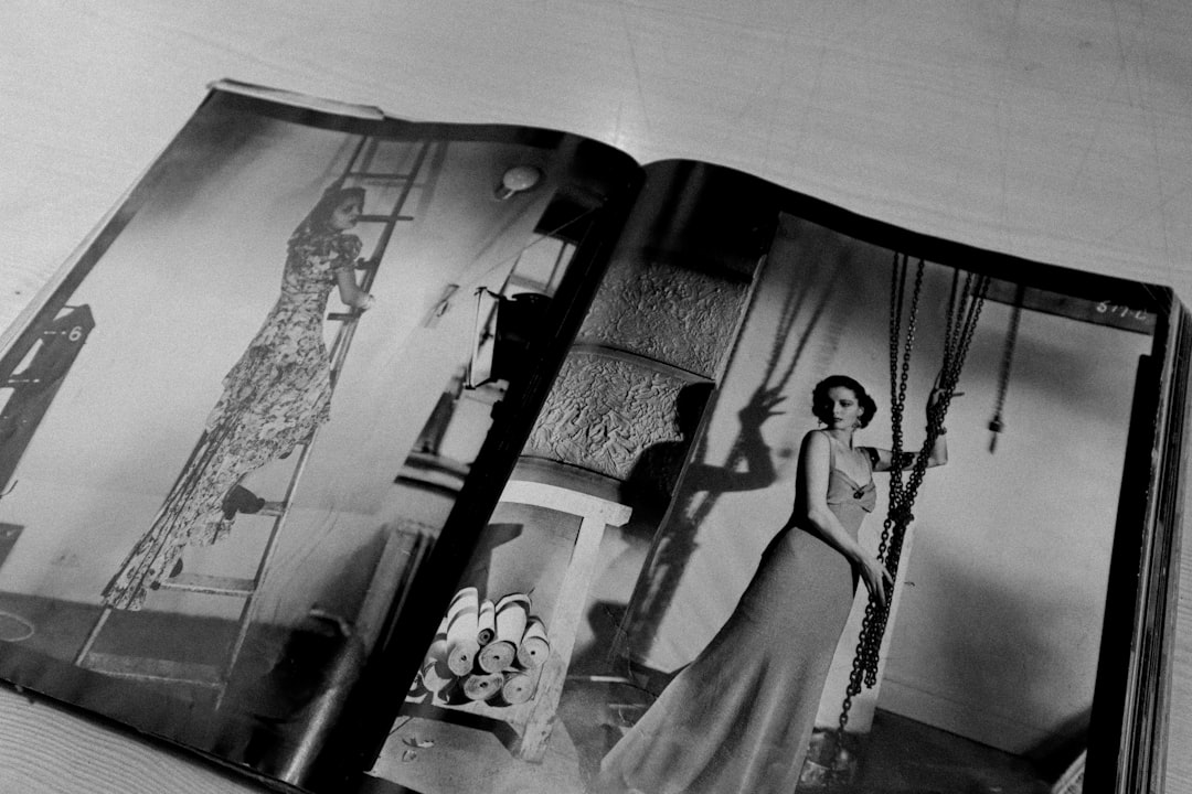a black and white photo of a woman in a dress